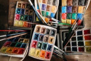 watercolor palette and paintbrushes