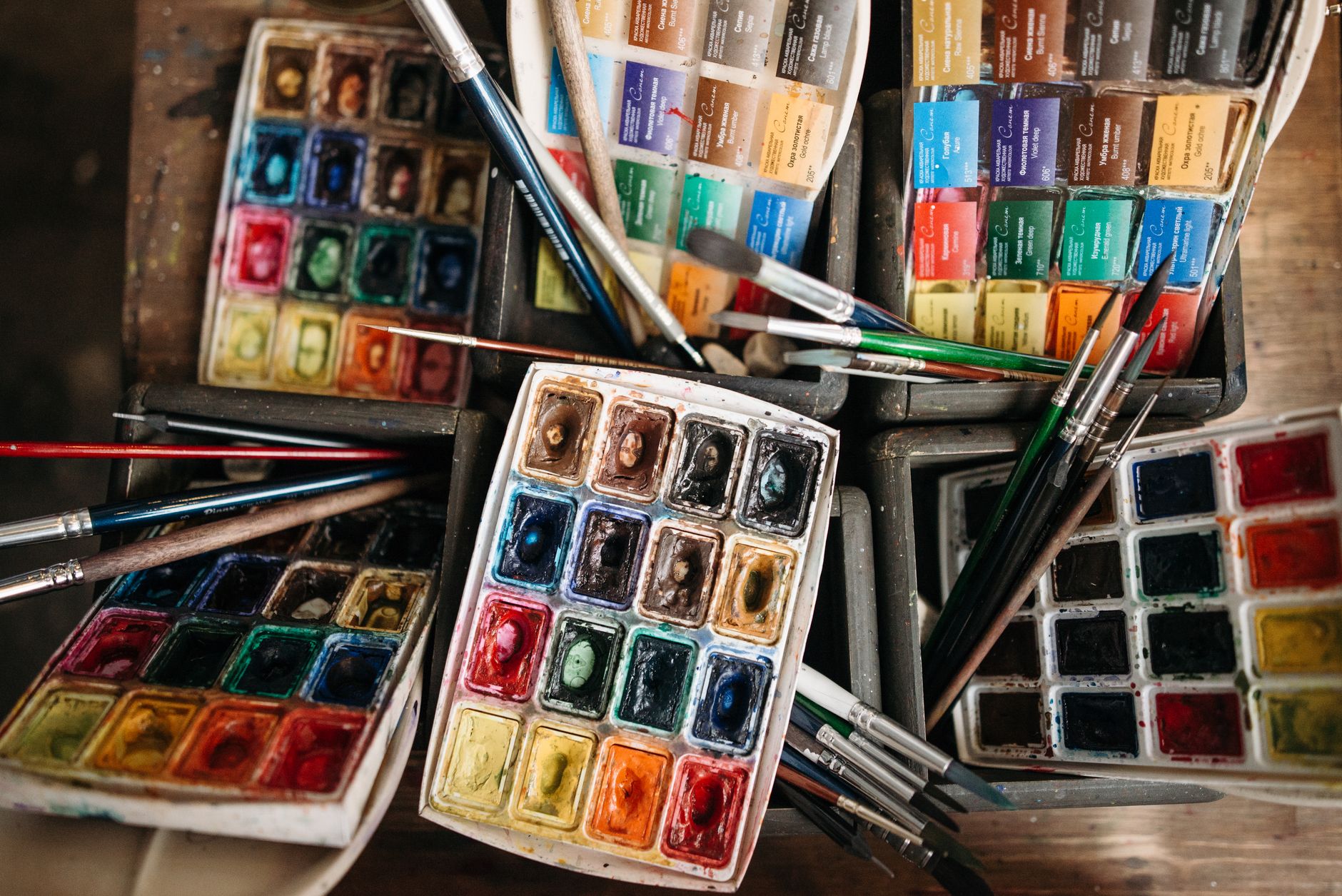 watercolor palette and paintbrushes